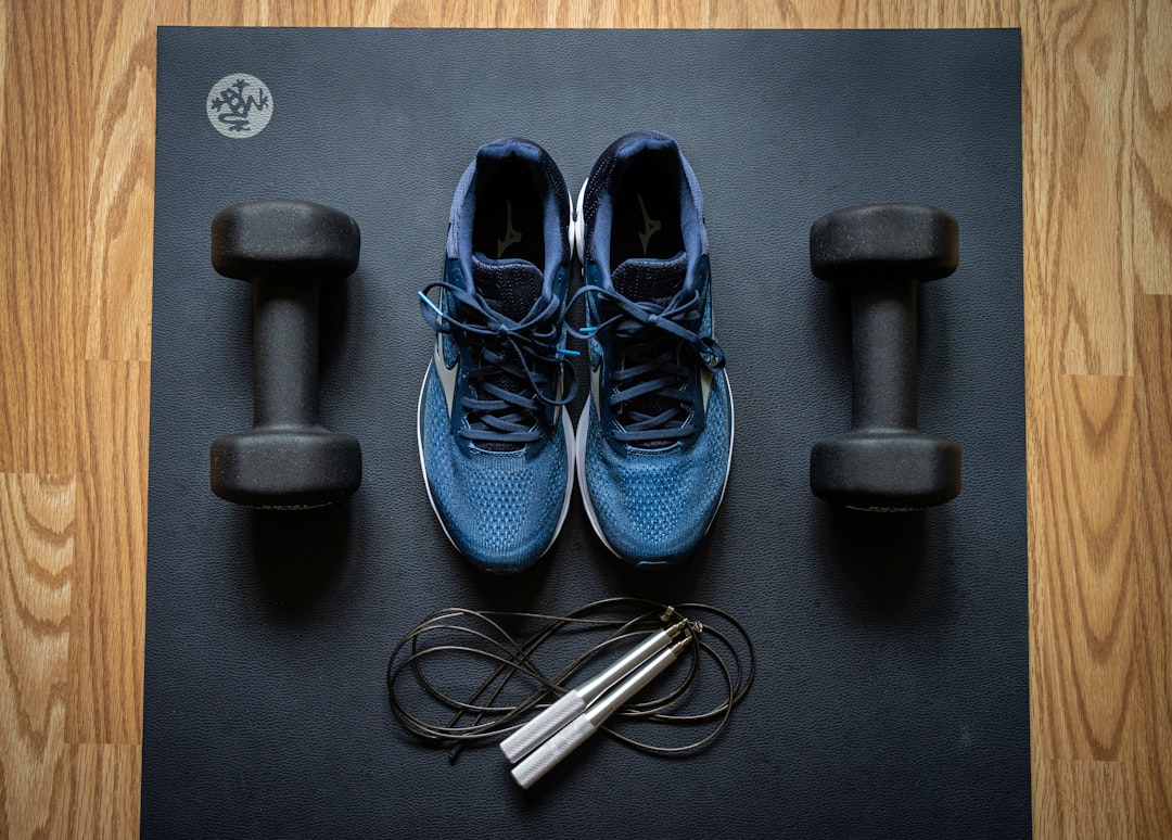 Home gym equipment by ProsourceFit dumbbells and Mizuno sneakers